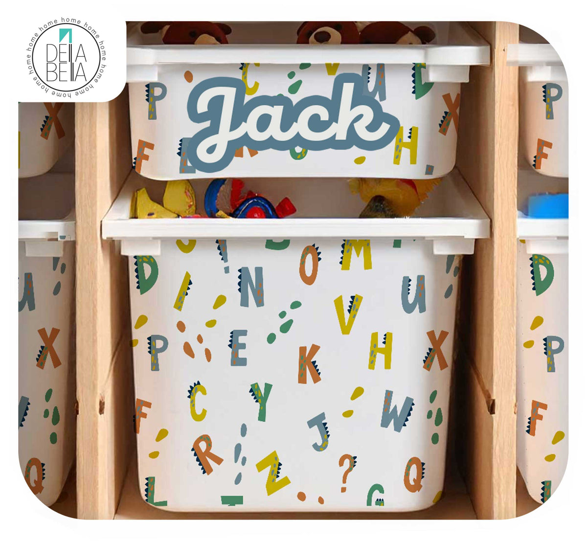 Personalised Jack name decal on IKEA Trofast toy storage bin with colourful dinosaur ABC pattern