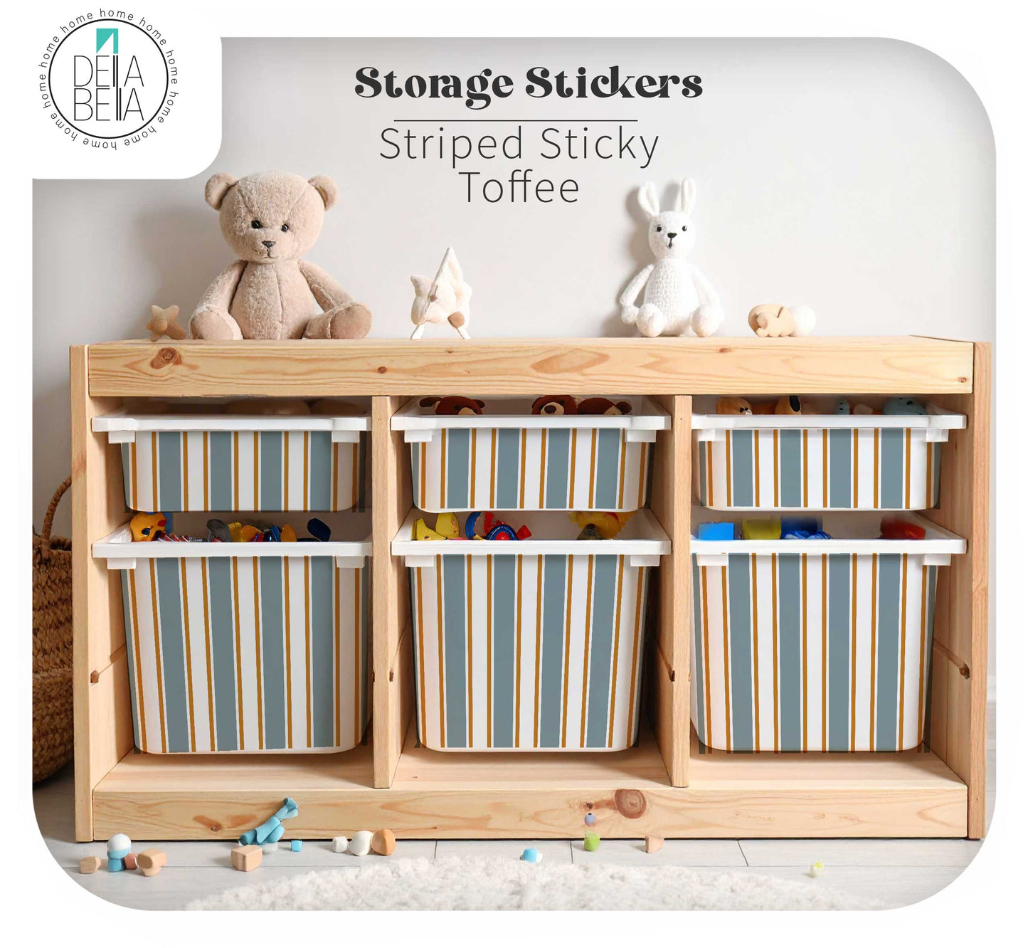 Wooden storage unit featuring plastic bins compatible with IKEA Trofast, decorated with Della Bella Striped Sticky Toffee vinyl decals in slate blue and gold for a neutral playroom.