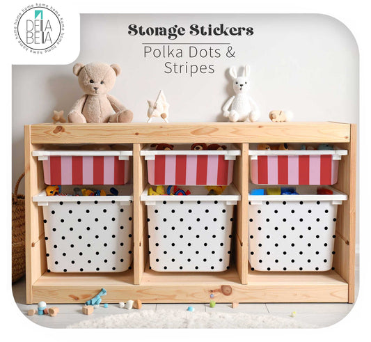 A  Ikea trofast children's storage unit with three open shelves and three stickers bins. The bins feature two designs: one with red and white stripes and one with black polka dots on a white background.