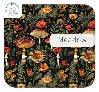  Close up of the Meadow mushroom pattern IKEA Trofast sticker featuring warm orange and red mushrooms, yellow meadow flowers, and green leaves on a dark background.
