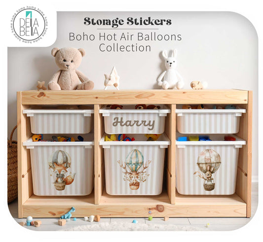 A trofast stickers wooden storage organizer with six striped bins decorated with boho hot air balloon illustrations, shown in a styled children's room setting with toys and plush toys on top. Text overlay reads 'Storage Stickers Boho Hot Air Balloons Collection' with a 'Deba Bella' brand logo in the top left.
