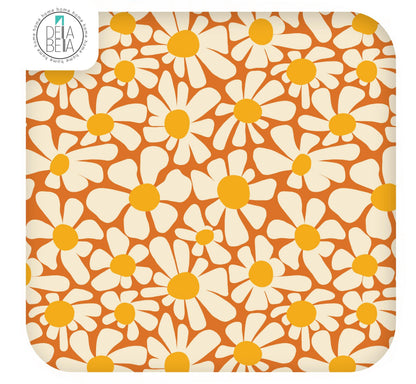 A sample piece of self-adhesive vinyl with a vintage daisy pattern, intended for use on furniture or other surfaces.